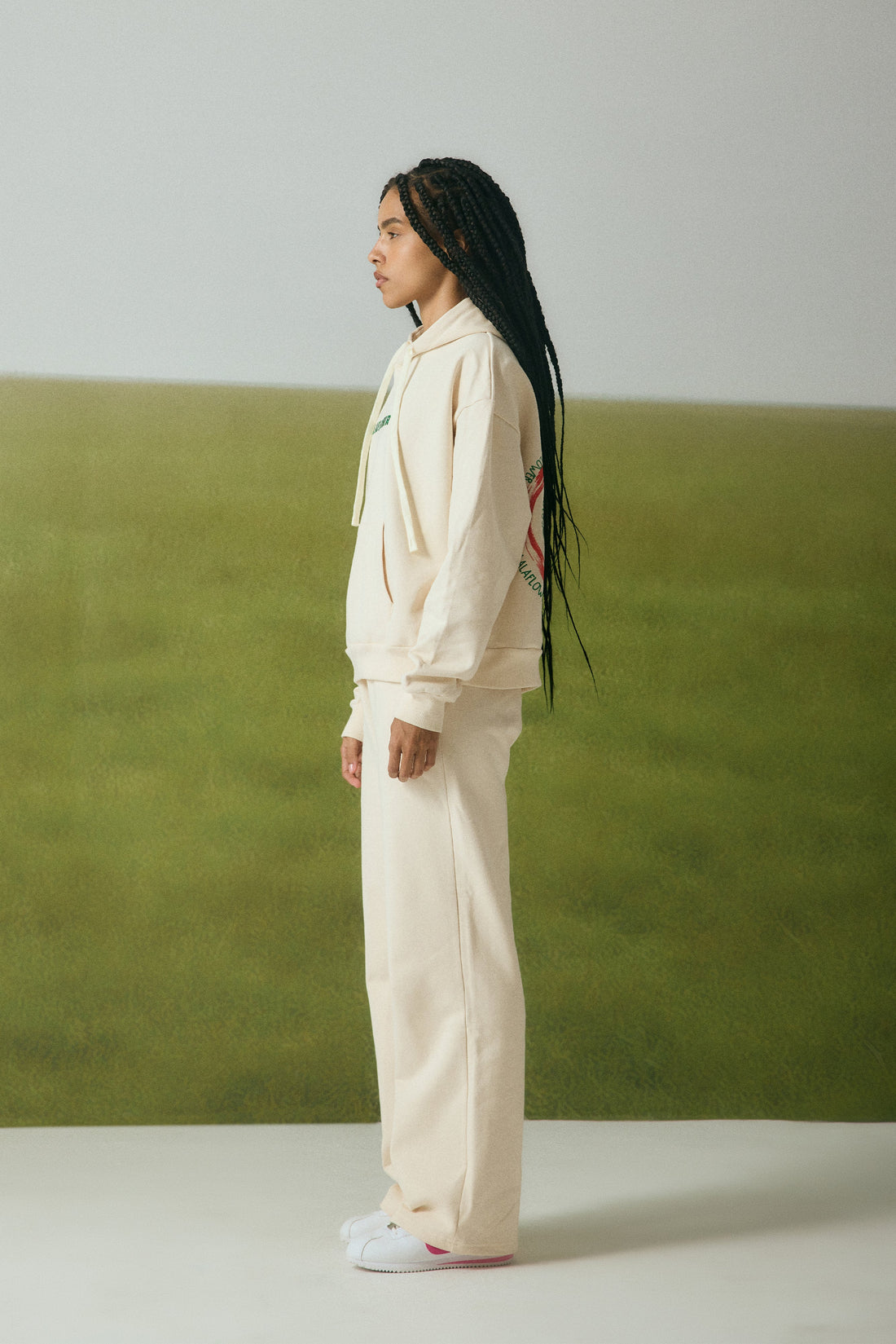OFF-WHITE SWEATPANTS WITH GREEN EMBROIDERY